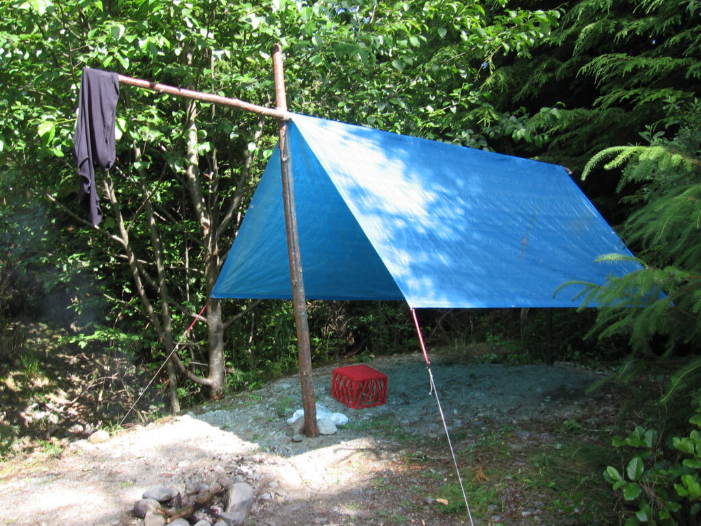 Tarpaulin to help keep water away from tent